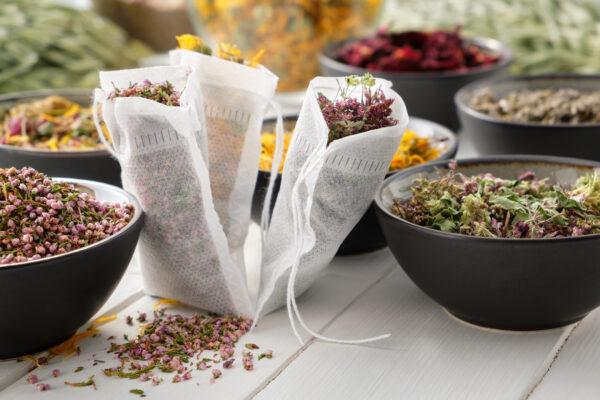 Bowls and bags of herbs from the Wild Blooms Botanicals Kit